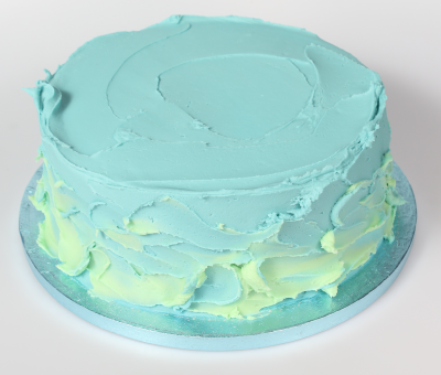 Cake covered in next layer of buttercream